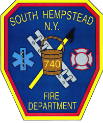 A patch of fire department that is in the middle of a field.